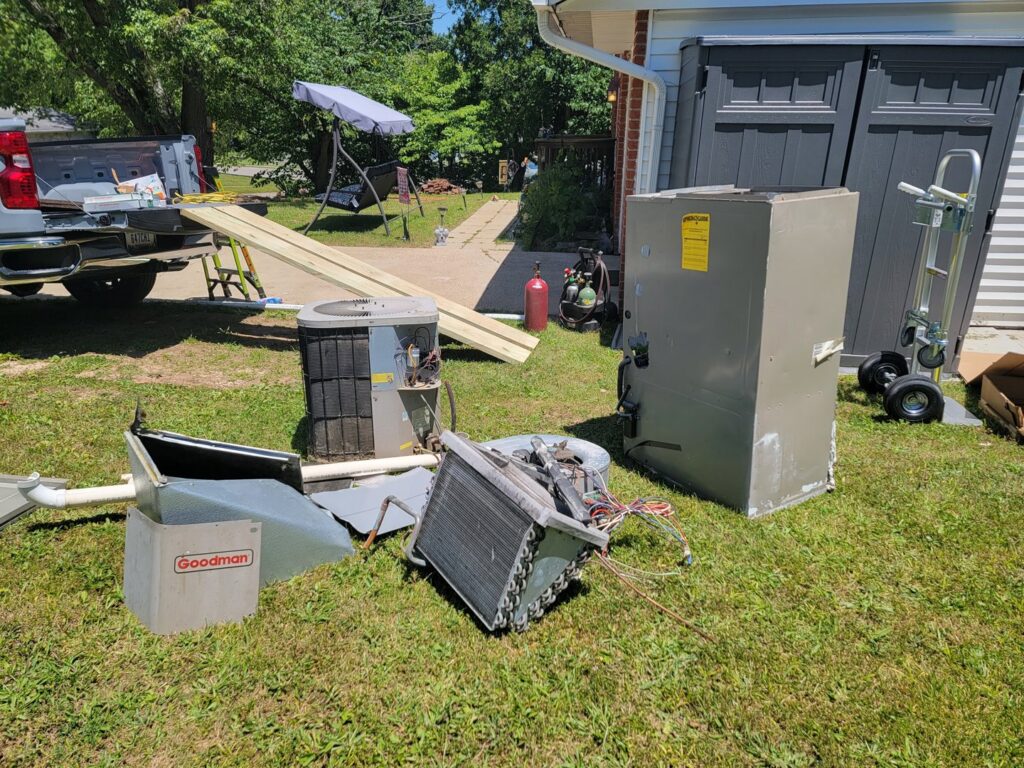An outdoor AC unit installed under a deck by S&B heating and cooling in Florence, KY.