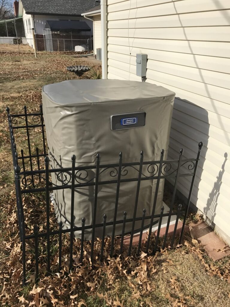 An outdoor air conditioning unit covered for winterization, installed by Epic Heating & Cooling in Wichita, KS.
