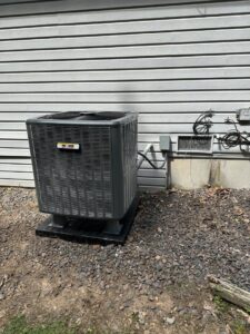 An outdoor AC unit featuring the One Hour Heating & Air Conditioning of Springfield logo, installed in Springfield, MO.
