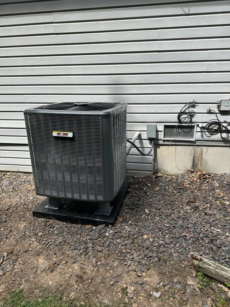 An outdoor AC unit featuring the One Hour Heating & Air Conditioning of Springfield logo, installed in Springfield, MO.