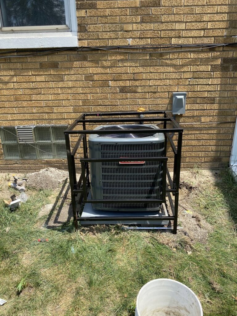 An outdoor air conditioning unit with a protective cage installed by Total HVAC - Heating and Cooling in Nashville, TN.