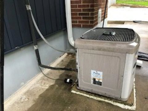 An outdoor air conditioner unit installed by Bellis Heating & Cooling in Independence, MO.