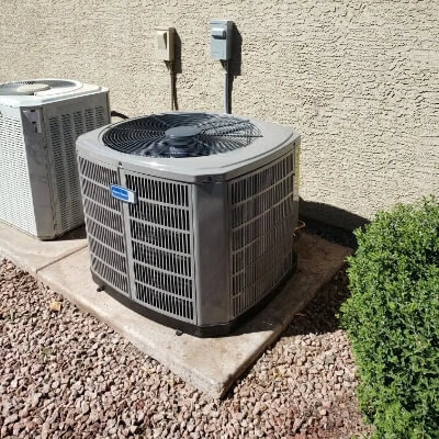 An outdoor air conditioner unit installed at a property by Colton Air Conditioning - Las Vegas in Las Vegas, NV.
