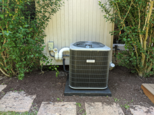 An outdoor air conditioning condenser unit installed by Lifeline Heating and Cooling in Livonia, MI.