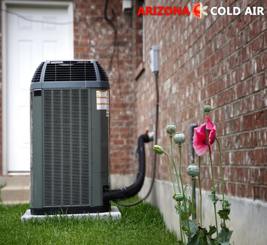 An outdoor air conditioning unit next to a brick house, representing HVAC services from Arizona Cold Air in Mesa, AZ.