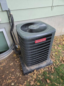 An outdoor Goodman brand air conditioning unit installed by Goodie Heating & Air in Sandy, UT.