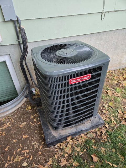 An outdoor Goodman brand air conditioning unit installed by Goodie Heating & Air in Sandy, UT.