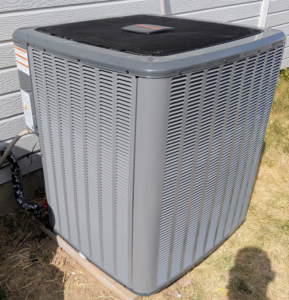A modern outdoor air conditioning unit installed by Heritage Heating and Air Conditioning in Nampa, ID