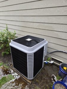 A modern outdoor air conditioning unit installed by Sound Comfort Heating & Air Conditioning in Everett, WA.