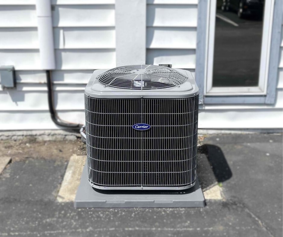 A newly installed outdoor air conditioning unit next to a residential home by STAR Heating Cooling Plumbing in Fishers, IN.