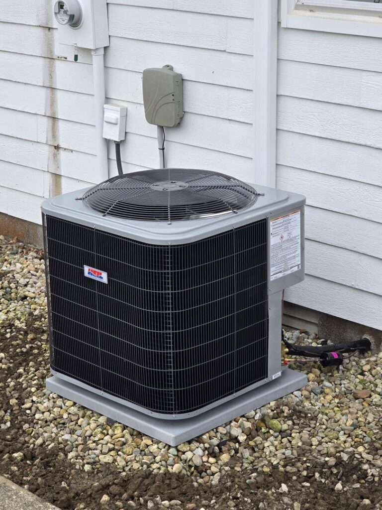 A newly installed outdoor air conditioning unit next to a residential building by Warren Mechanical, LLC in Carmel, IN.