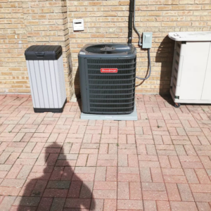 An outdoor Goodman air conditioning unit installed by W.N. Heating & Cooling, Inc in Worth, IL