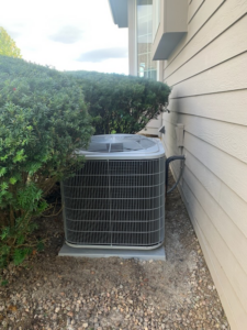 An outdoor air conditioning unit installed by Tom's Heating Service in Waukesha, WI.