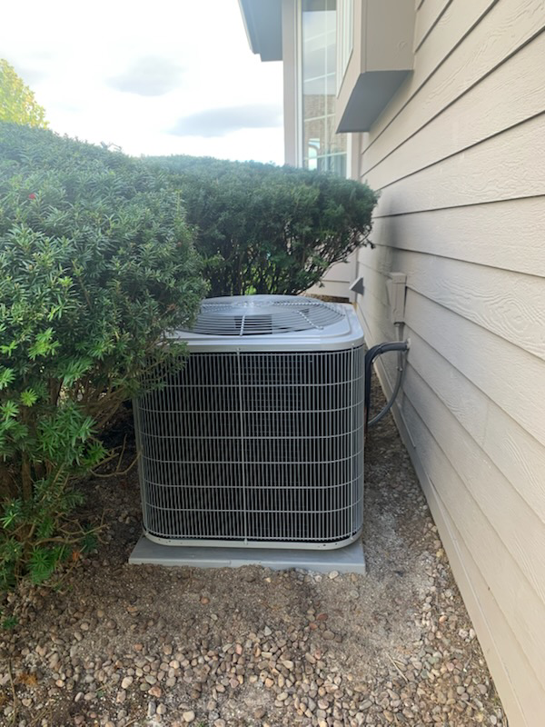 An outdoor air conditioning unit installed by Tom's Heating Service in Waukesha, WI.