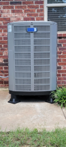 An outdoor American Standard air conditioning unit installed by A1 Mechanical Heating and Cooling Services in Waynesville, OH.