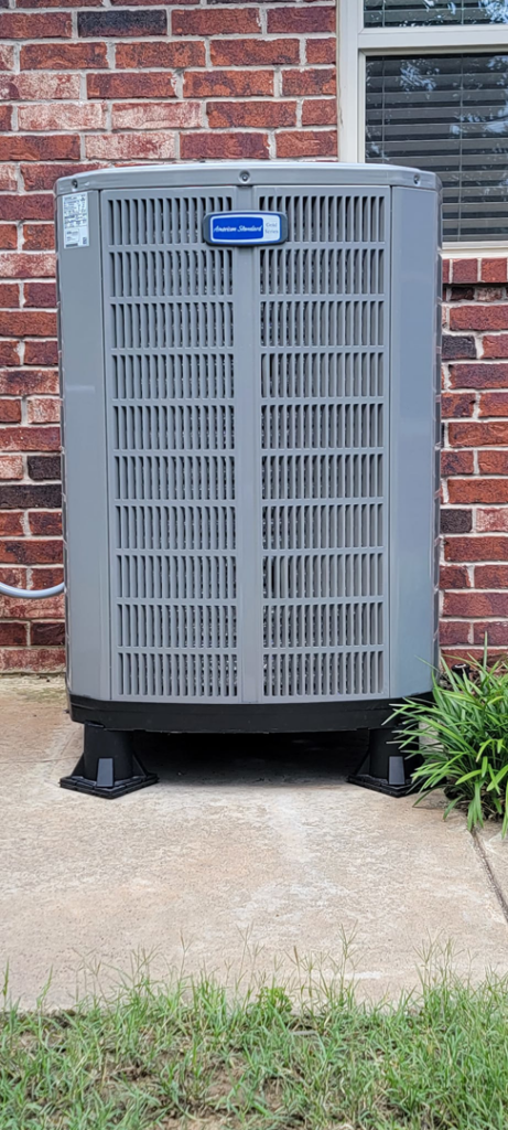An outdoor American Standard air conditioning unit installed by A1 Mechanical Heating and Cooling Services in Waynesville, OH.