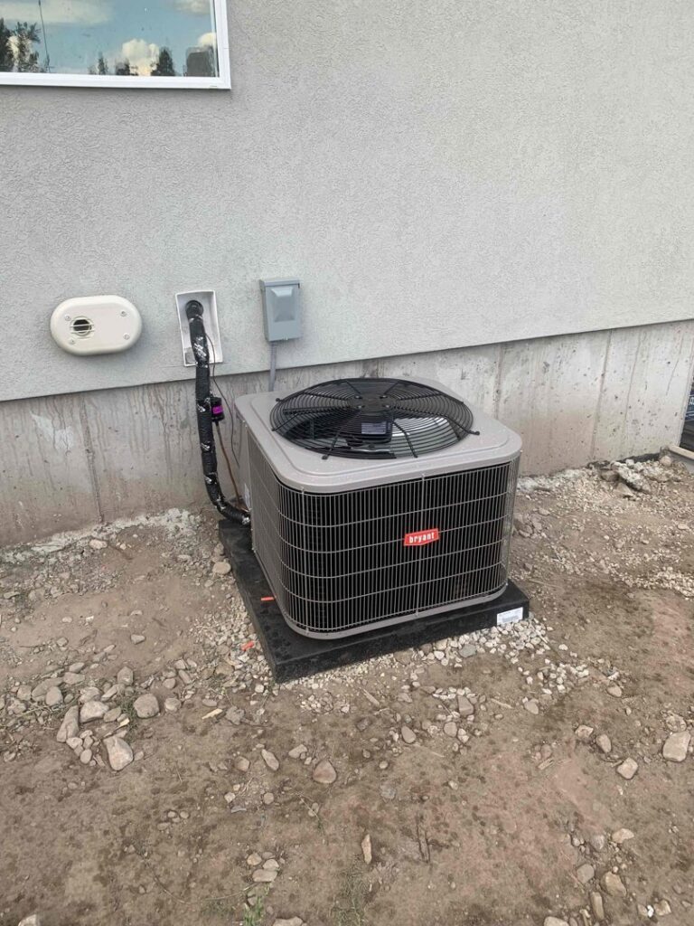 An outdoor Bryant air conditioning unit recently installed by ABT Heating and Cooling in Orem, UT.