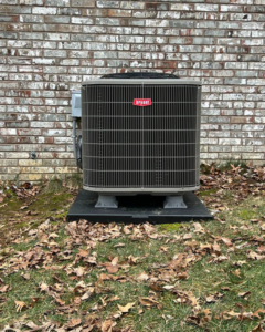 An outdoor Bryant HVAC unit installed next to a brick wall by Madison HVAC/R, Inc in Richmond, KY.
