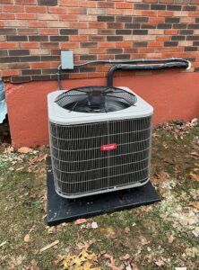An outdoor Bryant HVAC unit installed next to the side of a house by Madison HVAC/R, Inc in Richmond, KY.
