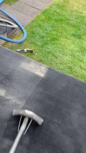 Outdoor carpet or turf being professionally cleaned with a steam wand by Super Duper Carpet & Duct Cleaning in Pittsburgh, PA.