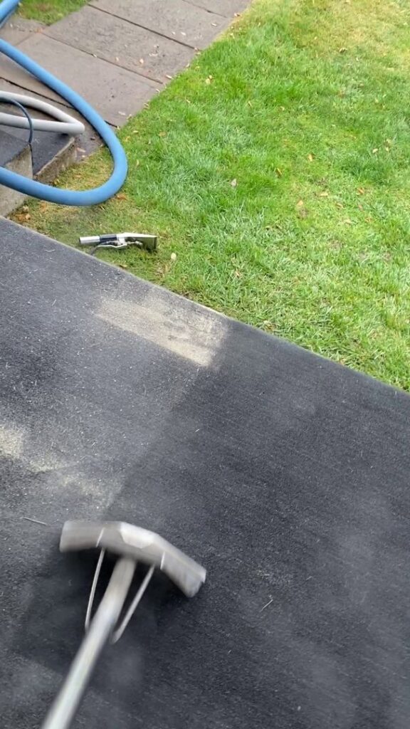 Outdoor carpet or turf being professionally cleaned with a steam wand by Super Duper Carpet & Duct Cleaning in Pittsburgh, PA.