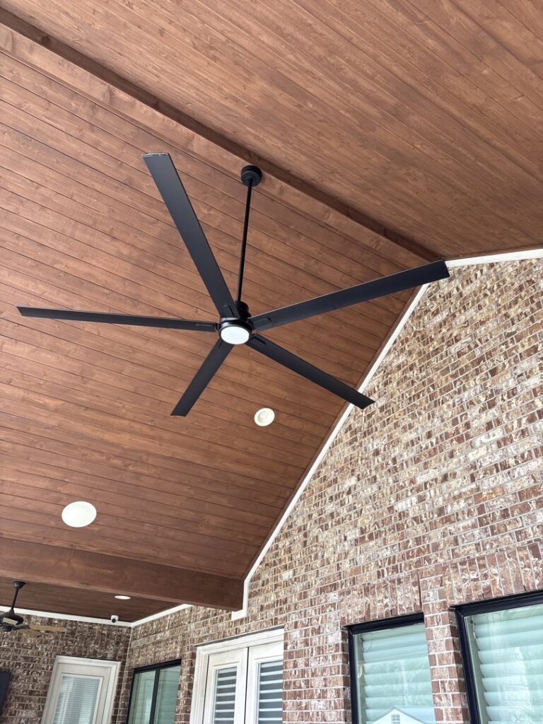 Installation of a large outdoor ceiling fan on a patio by Ark Electrical Service in Tomball, TX