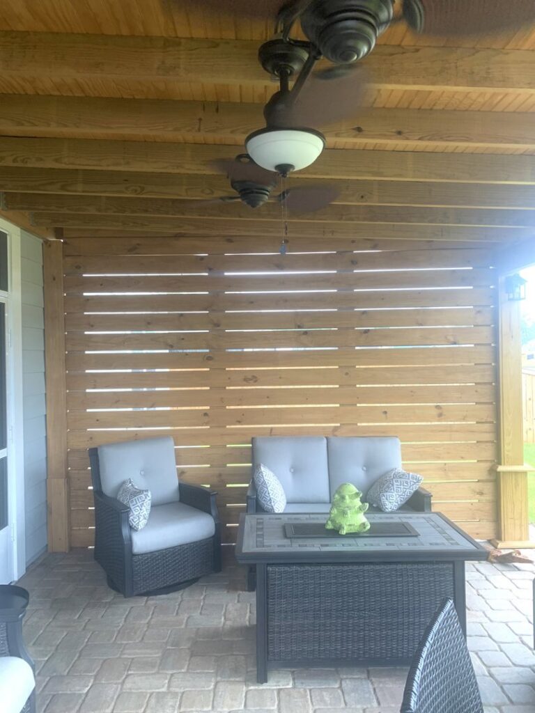 An outdoor patio with two newly installed ceiling fans, a service provided by Miller Electric in Summerville, SC.