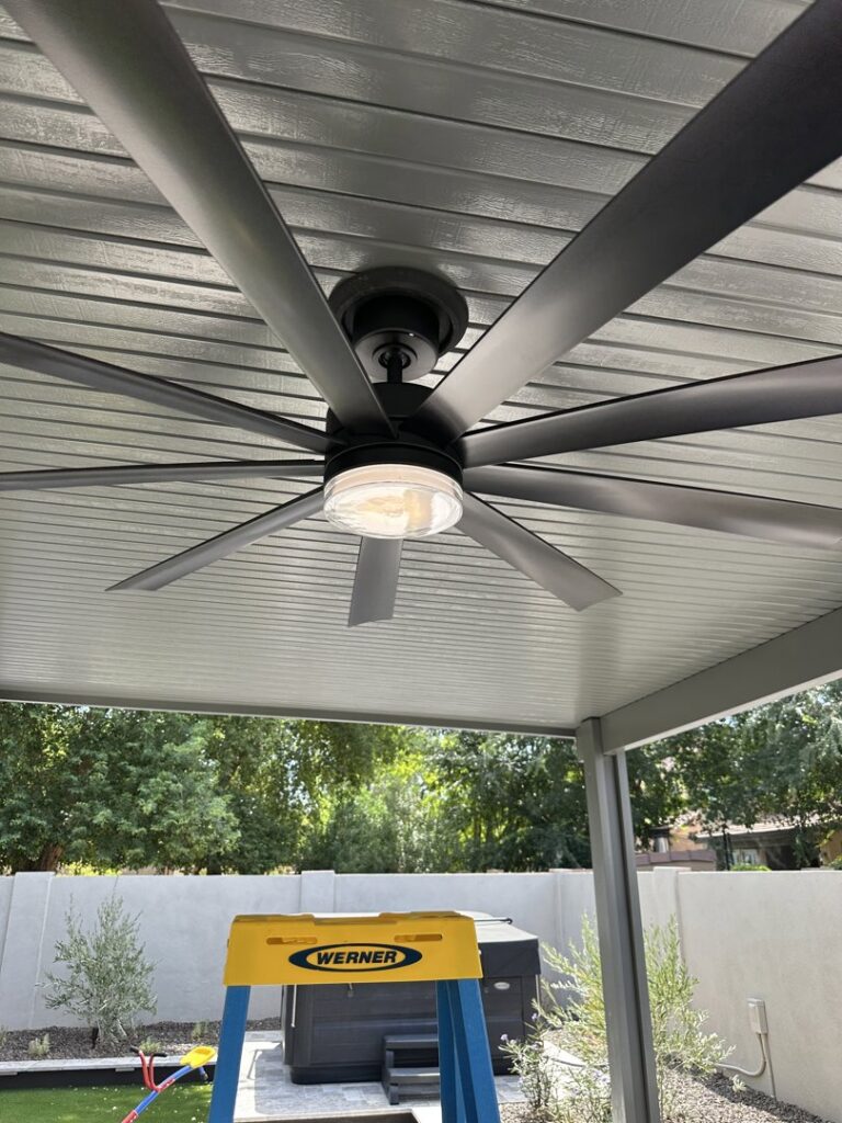 Large outdoor ceiling fan with integrated light installed on a patio by Sparks By Rabbit LLC in Scottsdale, AZ.