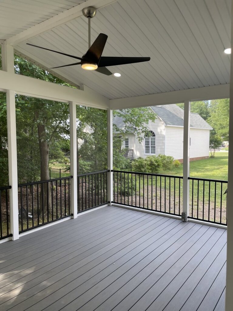 A modern outdoor ceiling fan installed on a screened porch by C. C. Taylor Electric LLC in Powhatan, VA.
