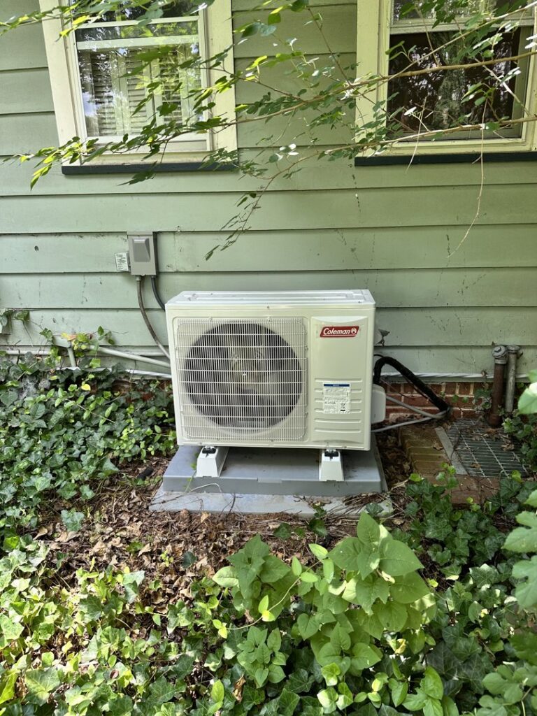 An outdoor Coleman mini-split unit newly installed next to a residential building by Mueller Mechanical HVAC in Philadelphia, PA.