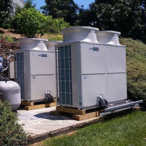 Two large outdoor commercial HVAC units installed on a patio by Mason Mechanical Services LLC HVAC Frederick Md in Jefferson, MD.