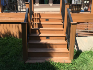 Outdoor deck stairs with integrated step lighting, a quality electrical installation by McPhillips Electric LLC in Columbus, NE.