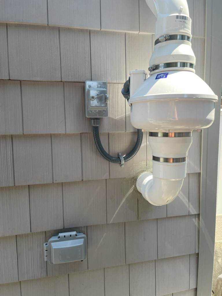 Outdoor electrical box and conduit installed on house siding by Richard A. Gibbons, an electrician in Dracut, MA.