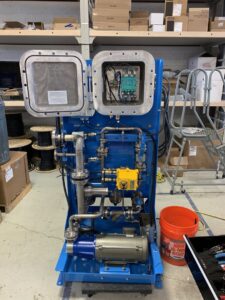 An open outdoor electrical breaker box showing internal wiring and circuit breakers by AMG Electric LLC Laramie, WY.