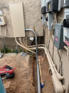 Outdoor electrical conduit and boxes installed with a trench, showing work by Industrial Edge Electrical in Gilbert, AZ.