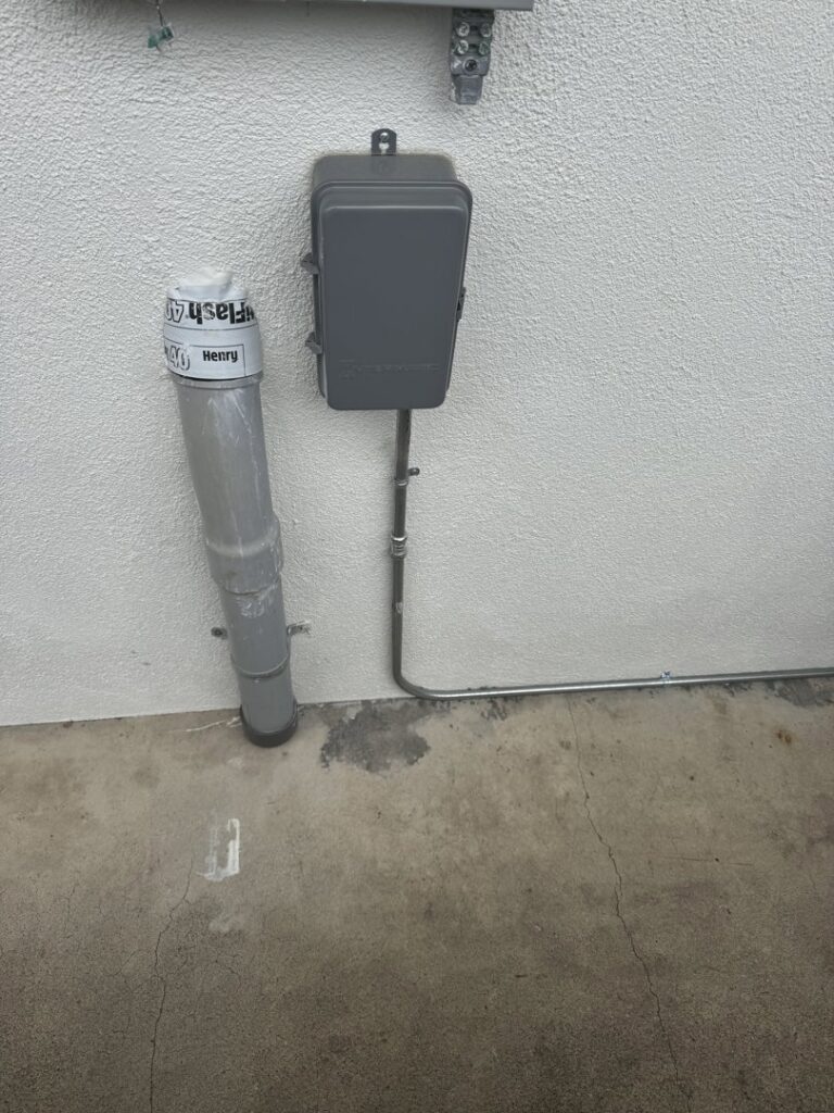 An outdoor electrical conduit and junction box installation by Steve Cavenee Electric in Orange, CA.