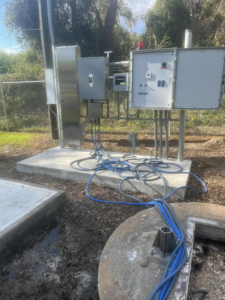 Outdoor electrical control panels with conduits and wiring, showing industrial electrical work by Middle Georgia Electric, Inc. in Macon, GA.