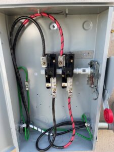 Internal wiring of an open outdoor electrical disconnect box by HomeRun Electric LLC in Arlington, TX