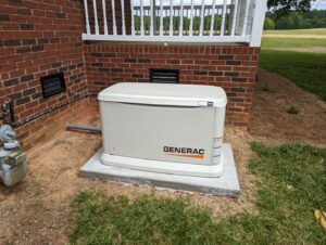 An outdoor electrical hookup installation on a wooden post by Starnes Electric LLC in Rock Hill, SC.