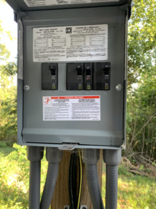 An outdoor electrical load center with circuit breakers installed by Hilman Electric LLC in Greenville, SC.