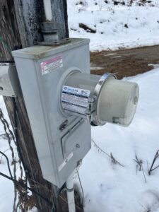 Outdoor electrical meter base and conduit installation on a utility pole by Russell Electric LLC in Saint Clair, MI
