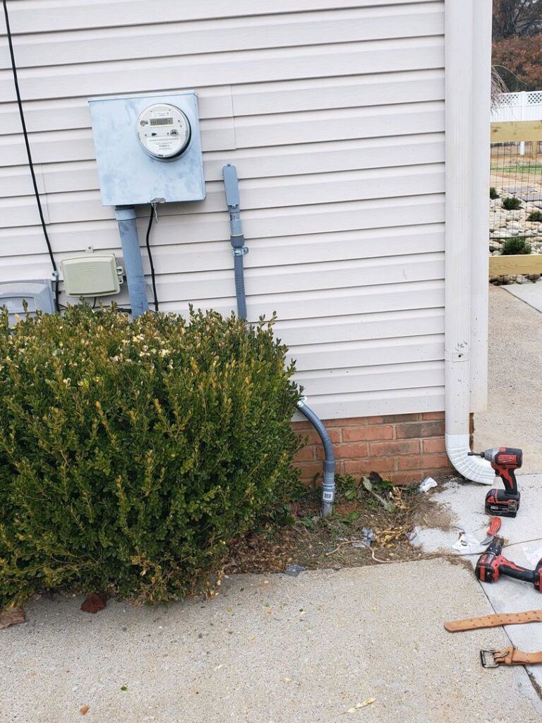 Outdoor electrical meter and conduit installation on a residential building by Discount Electrical Service of Franklin in Franklin, TN