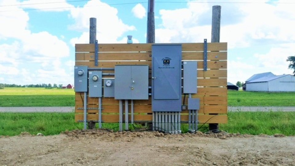 Multiple outdoor electrical meters and panels installed on a wooden structure by All Circuit Electrical LLC in Bryant, IN.