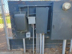 Outdoor electrical meter and panel installation on a wooden backboard by B&C Electric LLC in Bakersfield, CA