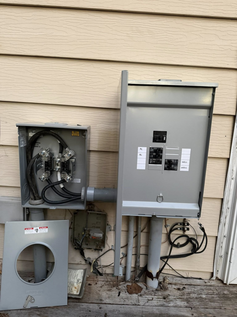 Outdoor electrical meter base and service panel installation by Power Tech Electrical Services in Durham, NC.