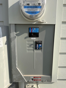 An outdoor electrical meter and service panel installed by Tenax Electrical Company in Jacksonville, FL.