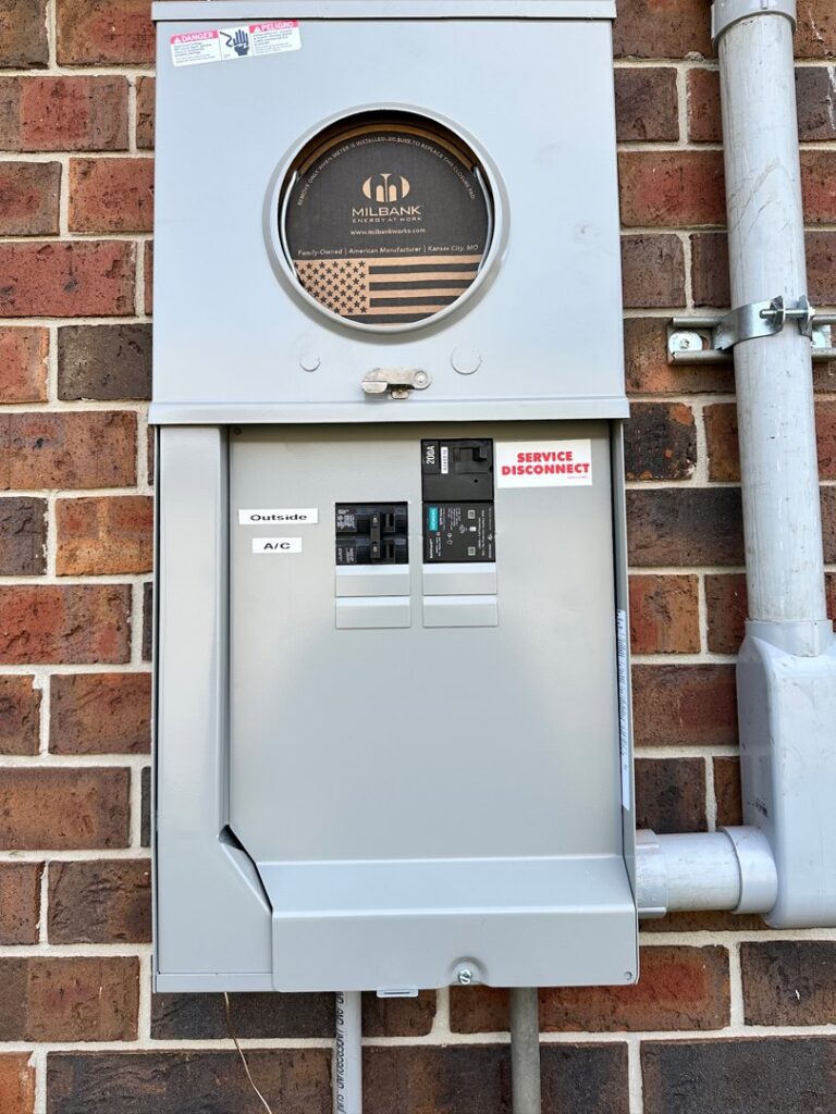 An outdoor electrical meter and service disconnect panel installed by LiveWire Electrical Services, LLC. in Houma, LA.