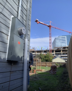 An outdoor electrical meter and service panel on a house, installed by AO Electric Inc. in Sacramento, CA.