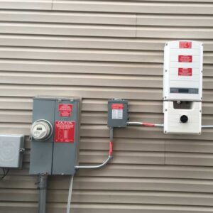 An outdoor electrical meter and solar inverter setup installed by Goal Electric LLC in West Valley City, UT.