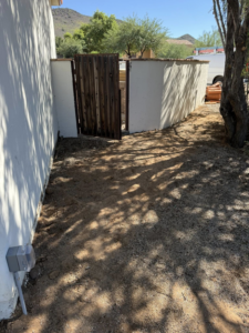 Outdoor electrical outlet and conduit installed near a gate by Dependable Sparky Electric in Peoria, AZ